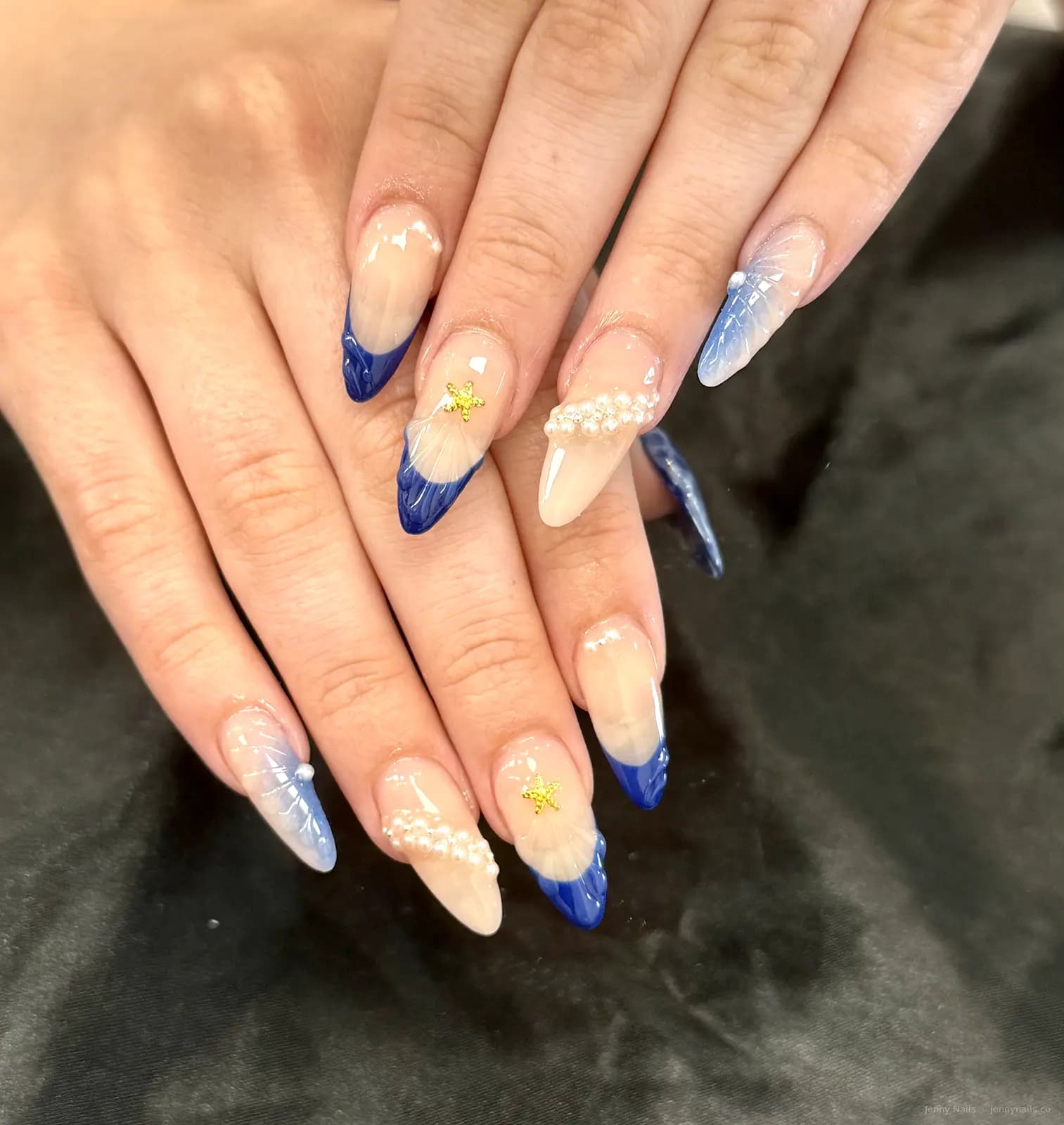 Blue and cream almond nails with delicate accents