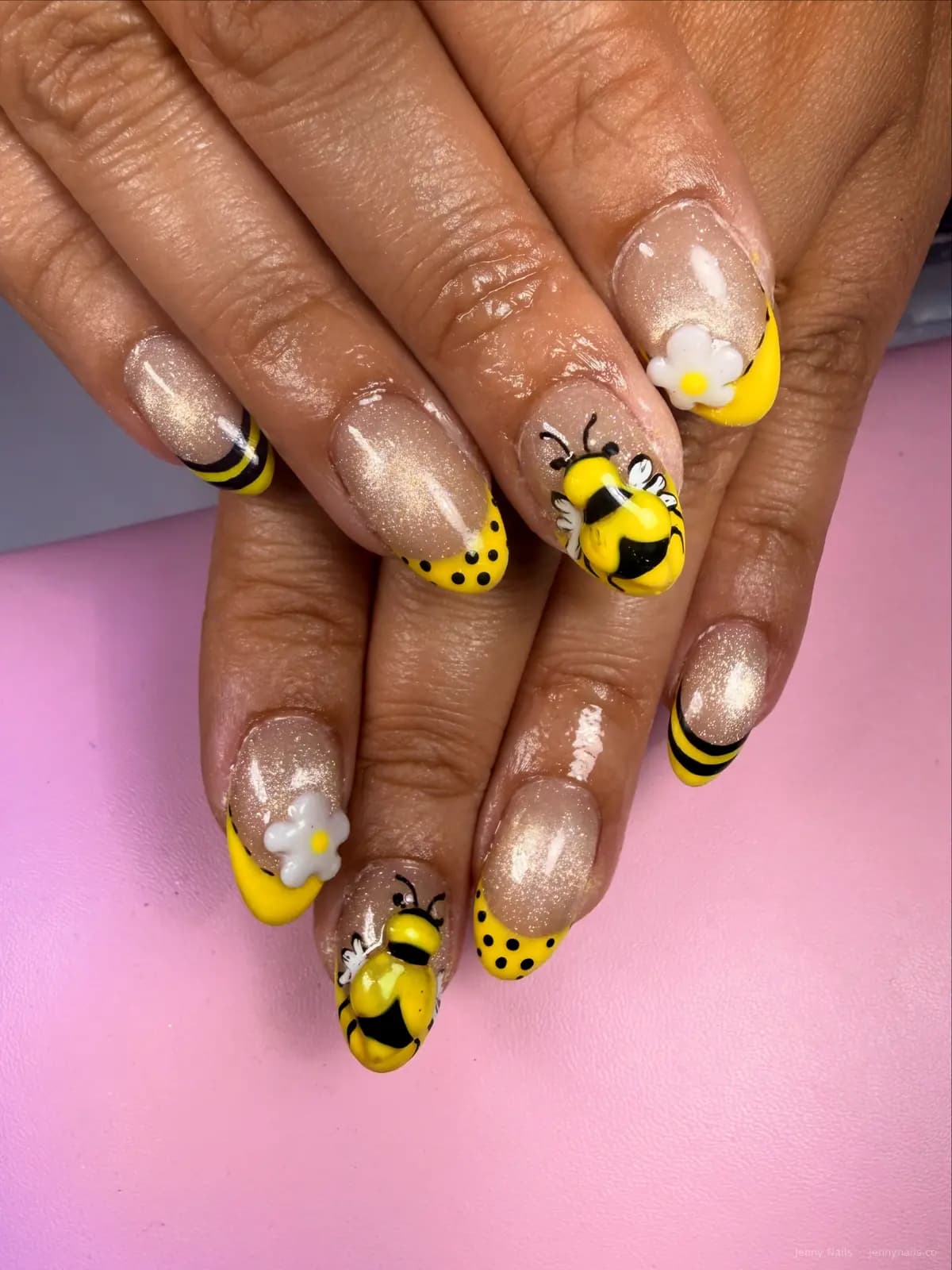Yellow and black nails with bee-inspired details