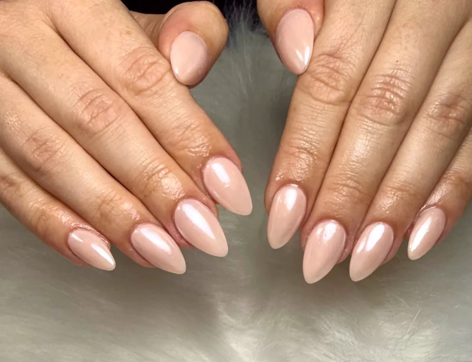 Natural pink almond nails with a glossy finish