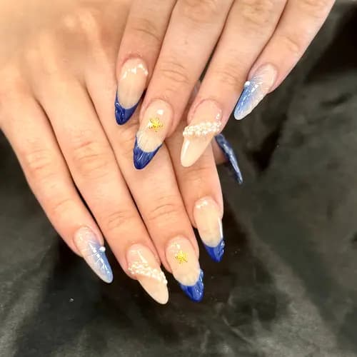 Blue and cream almond nails with delicate accents