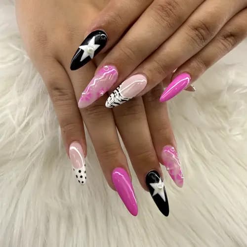 Bright pink, black, and white nails with star accents