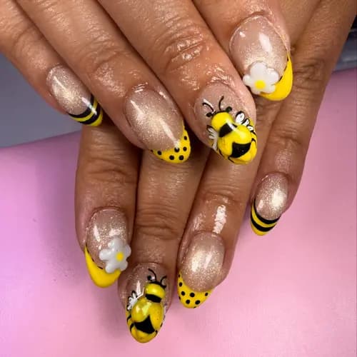 Yellow and black nails with bee-inspired details