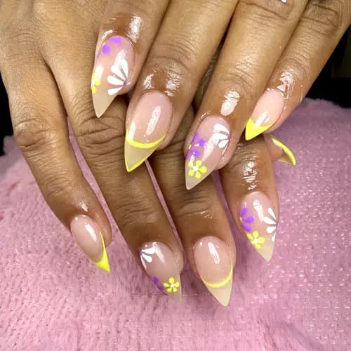 Yellow French tips with floral nail art